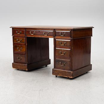 An English style desk, circa 1900.