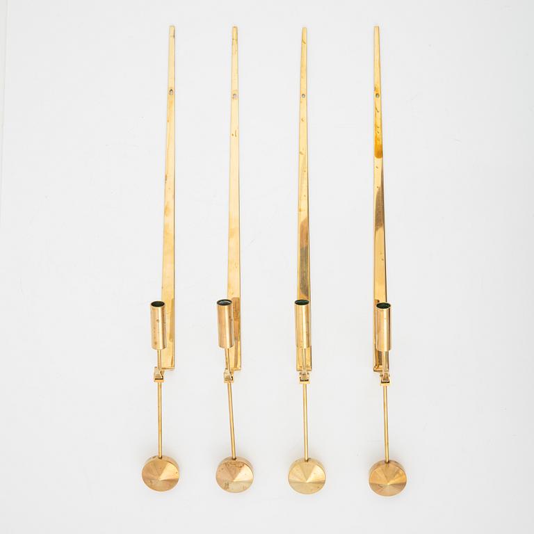 Pierre Forssell, a set of four brass 'Pendeln' wall lights from Skultuna, late 20th Century.