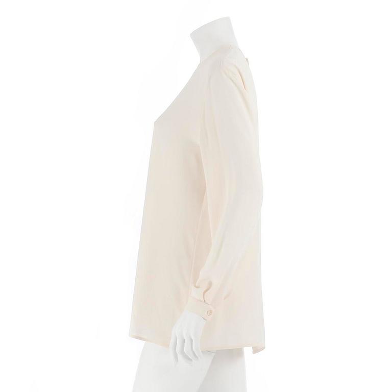 GIORGIO ARMANI, a créme colored silk blouse, size 42.