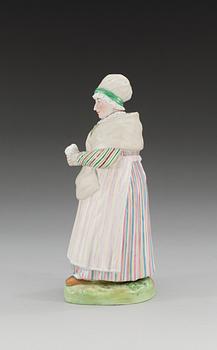 A Russian figure of a Lett woman, Gardner/Kuznetsov manufactory, ca 1900.