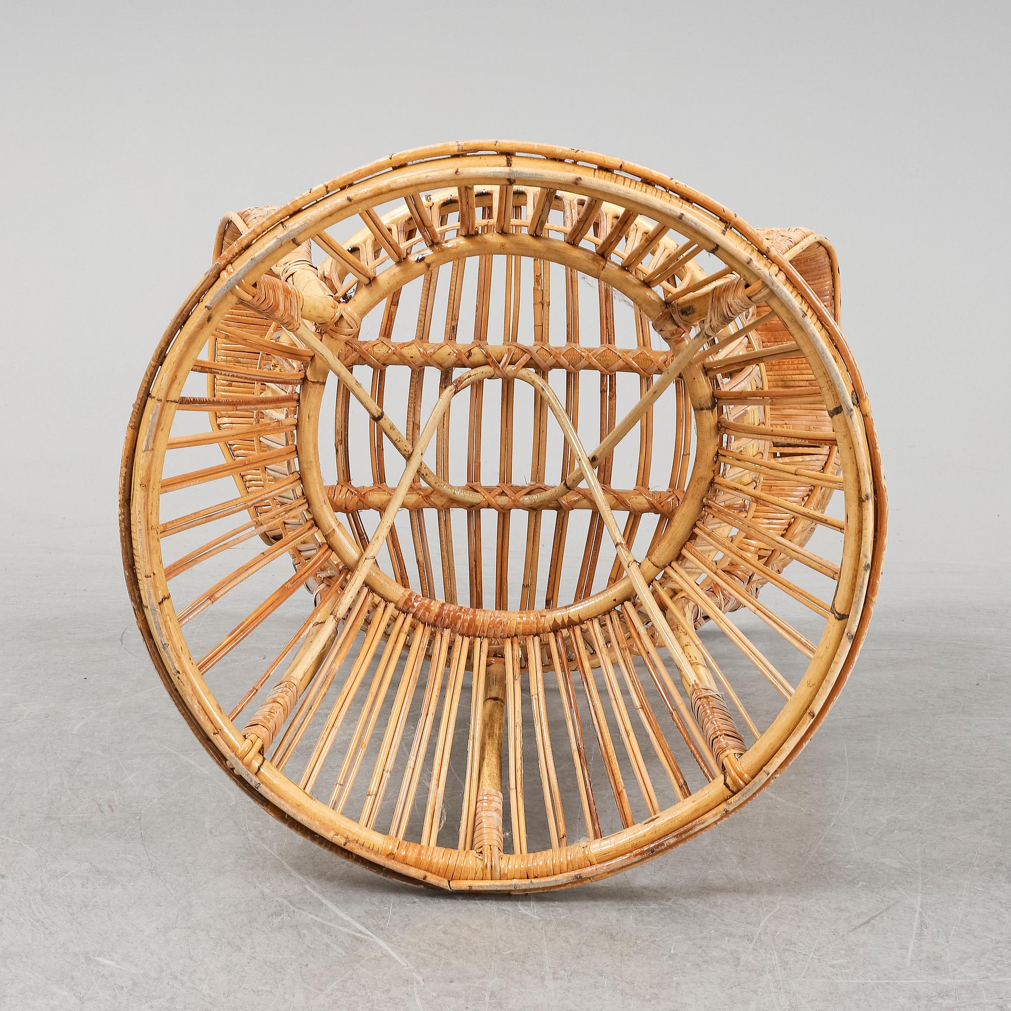 GIO PONTI & LIO CARMINATI, A 'Conte Biancamano' rattan Wingback Armchair for Bonacina, Italy.