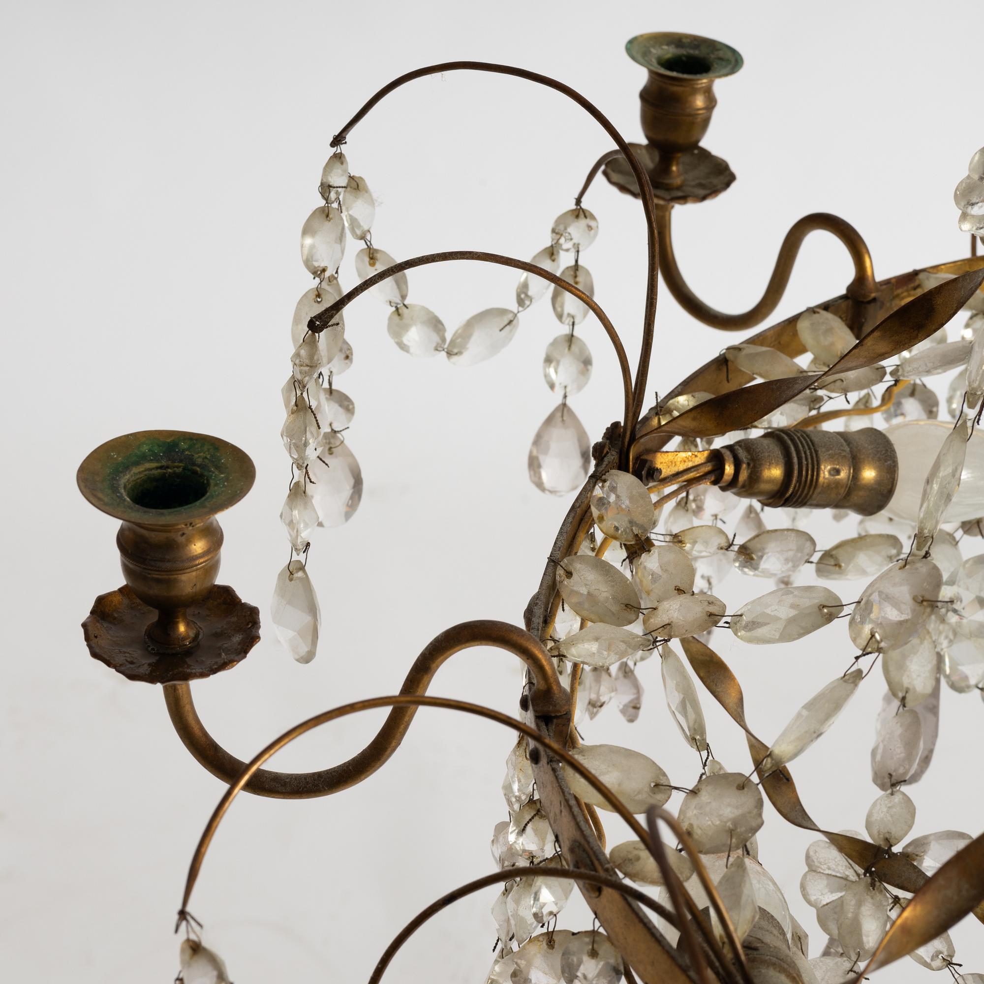 A late Gustavian gilt brass and cut glass seven-light chandelier, Stockholm, late 18th century.