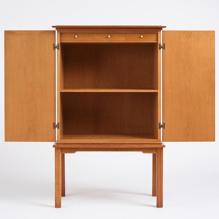 Oscar Nilsson, attributed to, a Swedish Modern oak cabinet, 1940s.