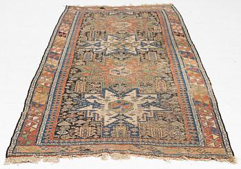 An oriental carpet, c 280 x 130 cm.