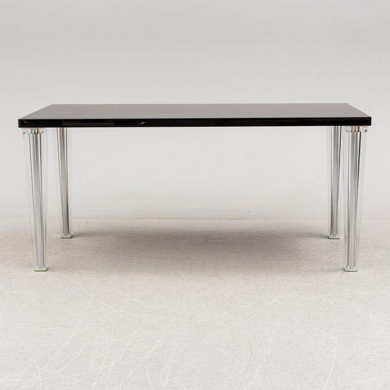 A "Tip Top" dining table by Philippe Starck for Kartell.