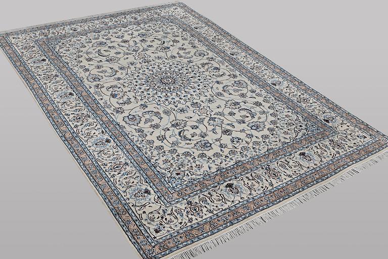 A carpet, Nain, part silk, 9 laa, c. 307 x 203 cm.