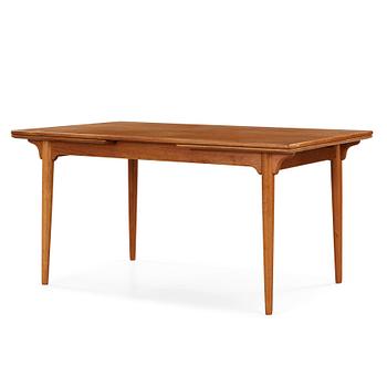 34. A Danish teak and oak dinner table, Denmark 1950's-60's.