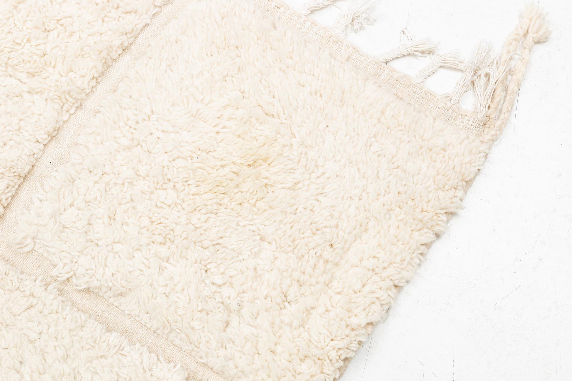 A Moroccan carpet, circa 308 x 181 cm.