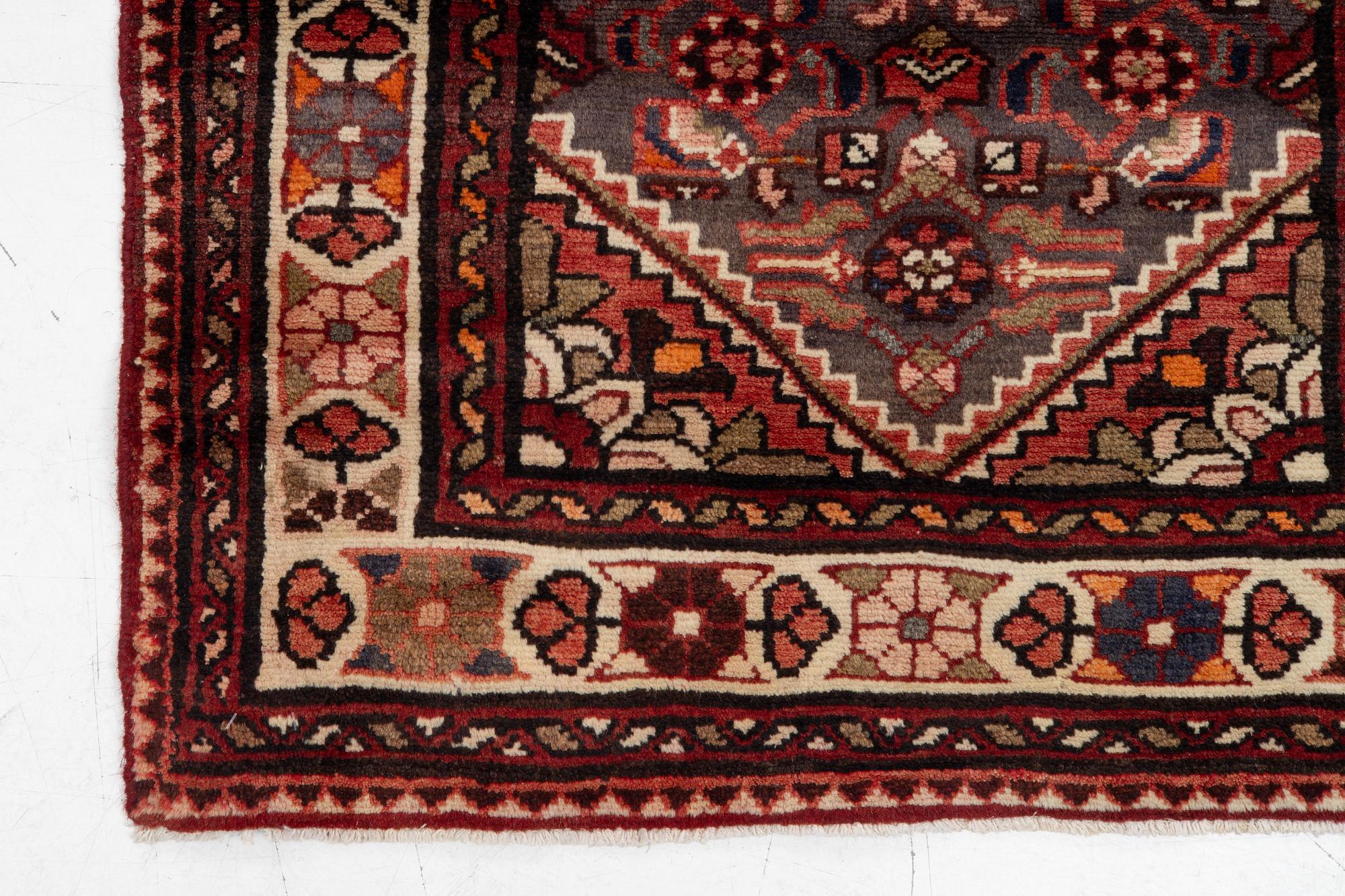A runner  carpet, Hamadan, 305 x 80 cm.