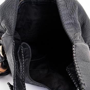 Gucci, a 'Bamboo Jackie Tassel' shoulder bag.