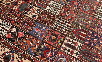 A semi-antique Baktiari carpet, approx. 360 x 308 cm.