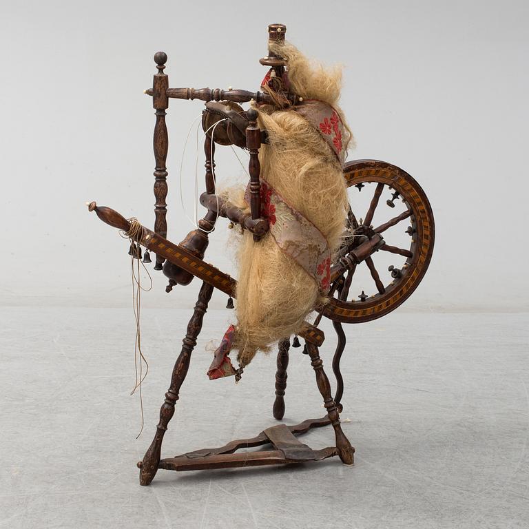 A 19th century spinning wheel.