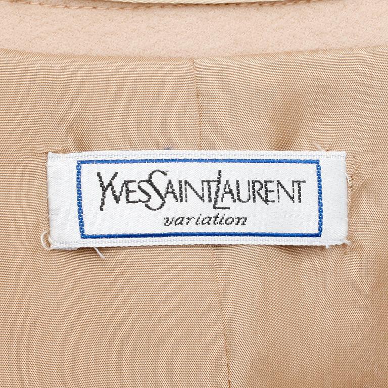 YVES SAINT LAURENT,  a beige wool overcoat.