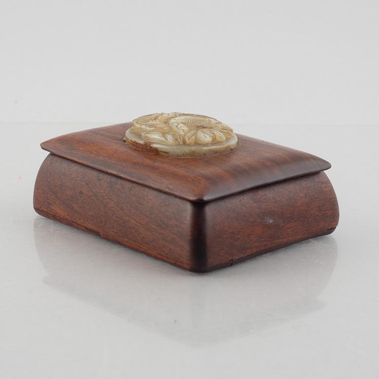 Two Chinese hardwood boxes with nephrite plaques, 20th century.