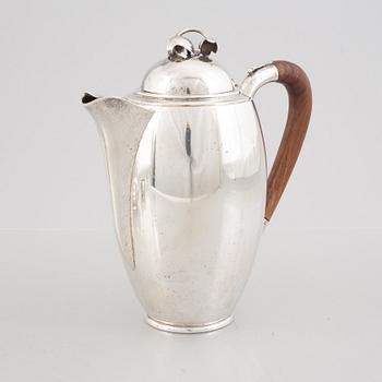 A Swedish Sterling Silver Coffee Pot, Creamer and Sugar Bowl, mark of Nordisk Silverkonst, Helsingborg 1948.