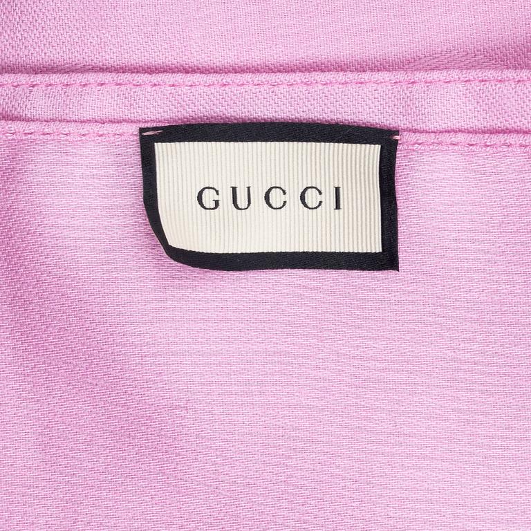 Gucci, a wool and silk mix "GG" jaquard shawl.