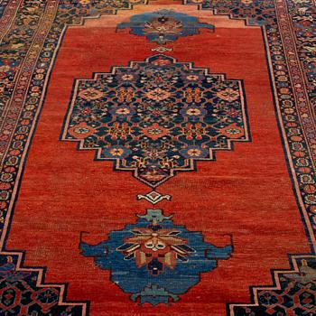 AN ANTIQUE BIDJAR CARPET, CA 374 X 224 CM.