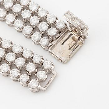 A platinum bracelet set with round brilliant-cut diamonds.