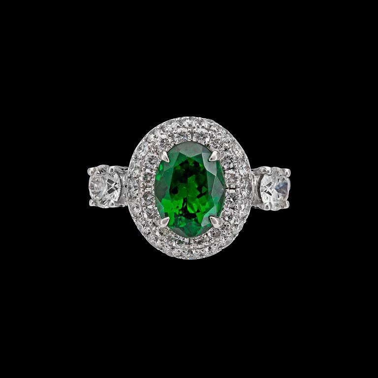 A tsavorite,2.05 cts, and brilliant cut diamond ring, tot. 1.23 cts.