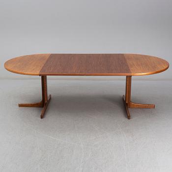 A walnut vereered dining table, mid 20th Century.