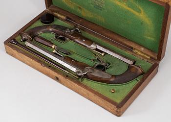 A 1840's French cased percussion pistols marked: Mre Rle de Maubeuge.