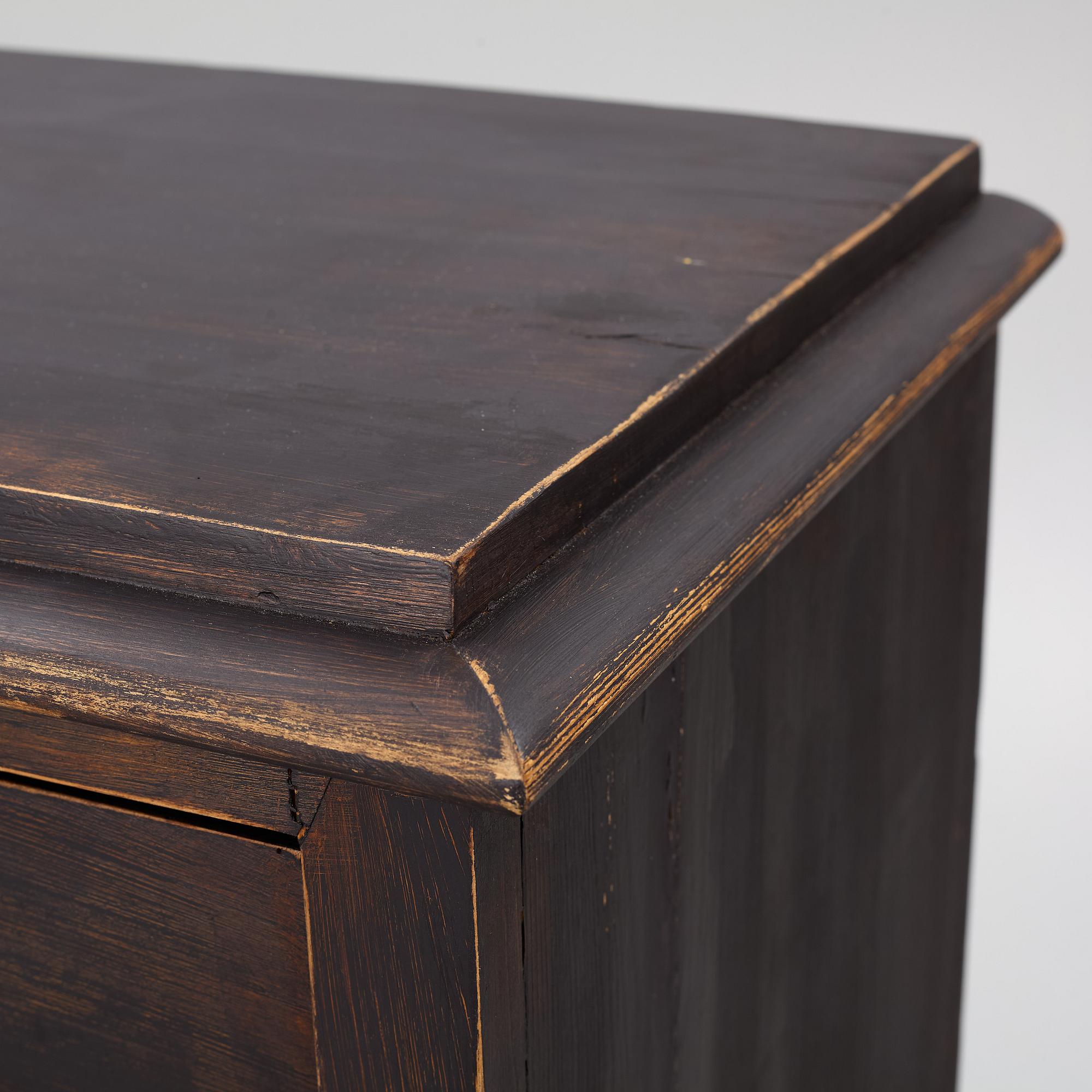 A chest of drawers, circa 1900.