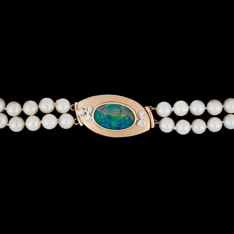 A two strand cultured pearl necklace with opal and brilliant cut diamonds, tot. 0.50 cts.