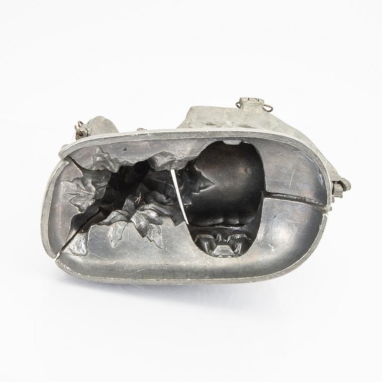 A set of four pewter icecream moulds around 1900.