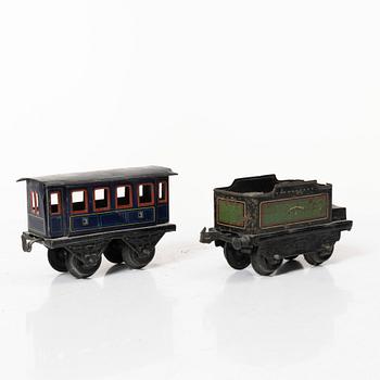 Model train with track and station building, 13 pieces, Germany, 1920s.