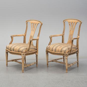 A pair of later part of th 18th century Gustavian arm chairs.