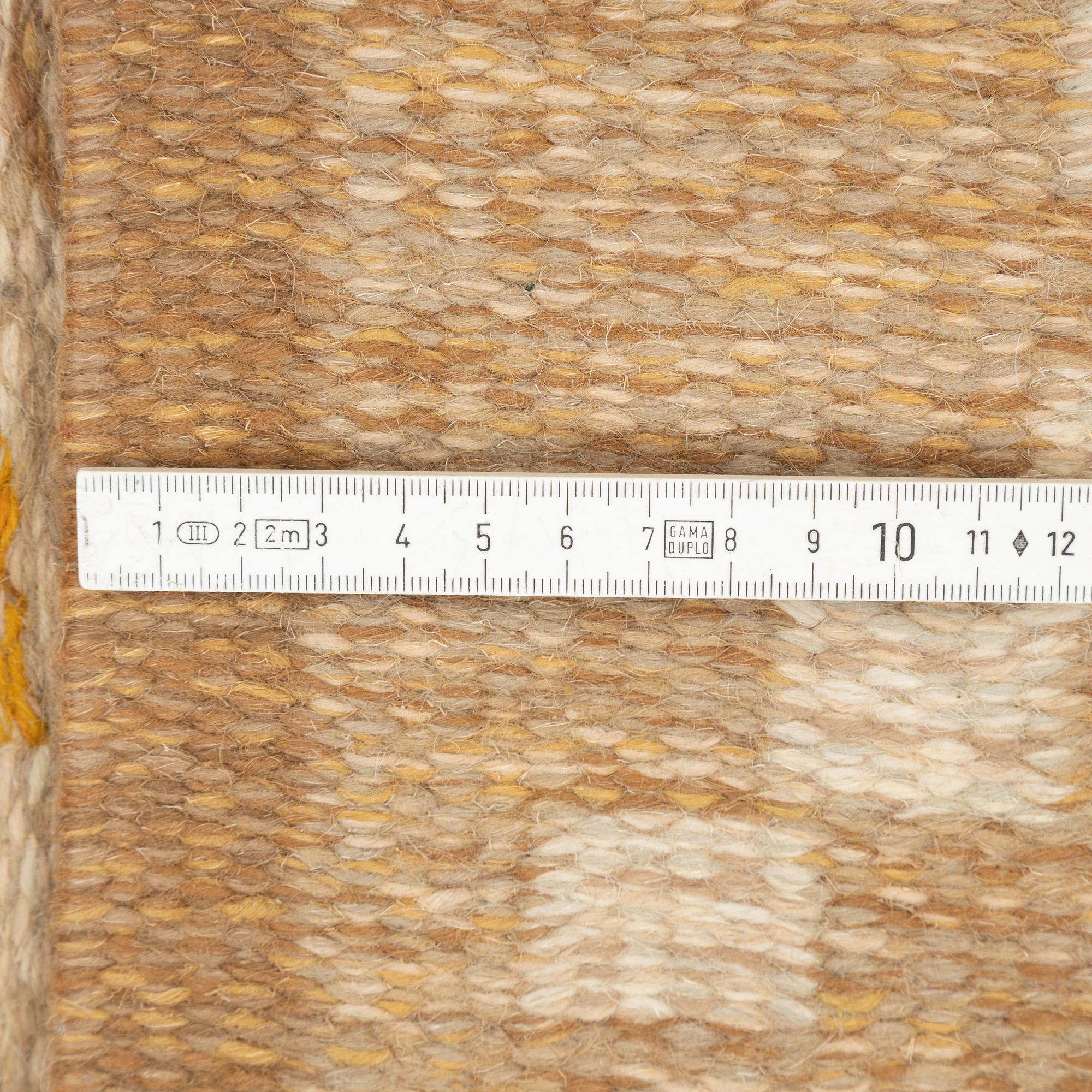 A flat weave rug, signed GG, Gitt Grännsjö-Carlsson, c. 205 x 138 cm.