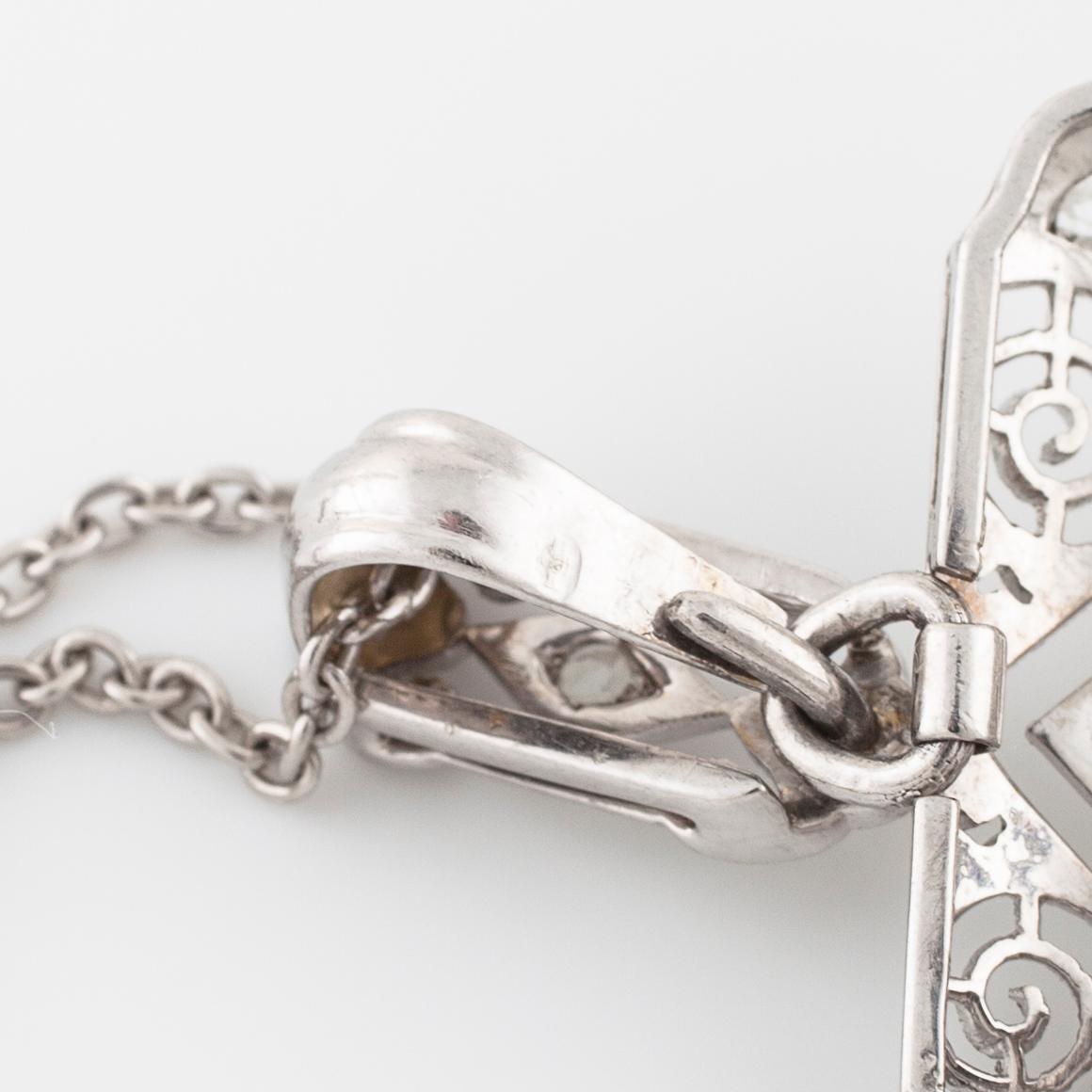 COLLIER/BROSCH, med rosen- och gammalslipade diamanter.