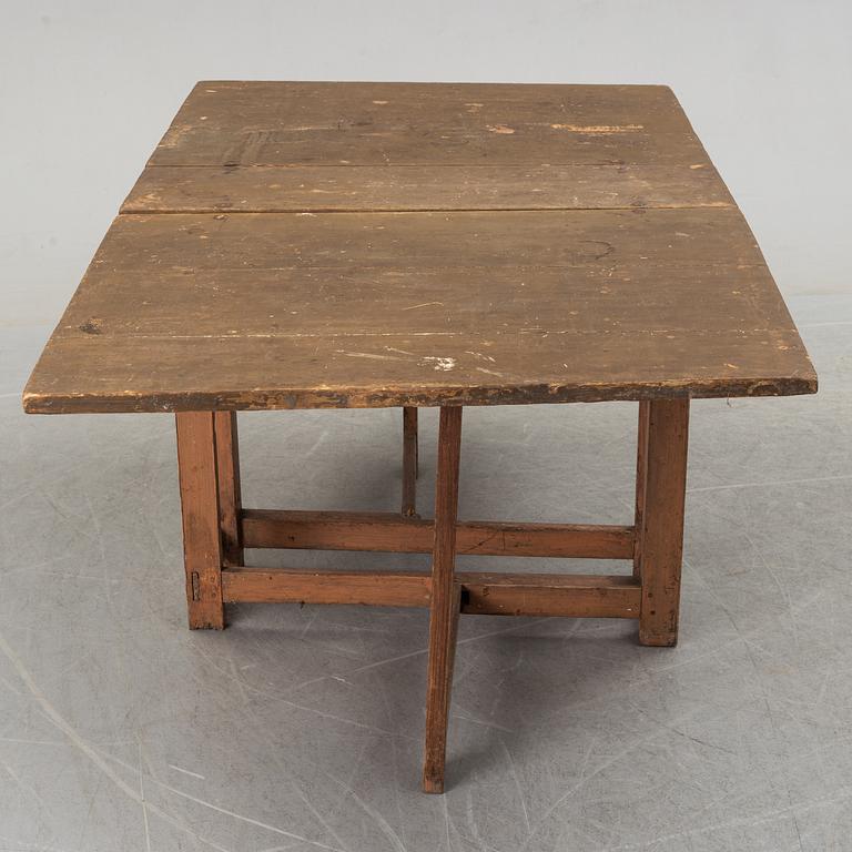 A 19th century painted gate leg table.