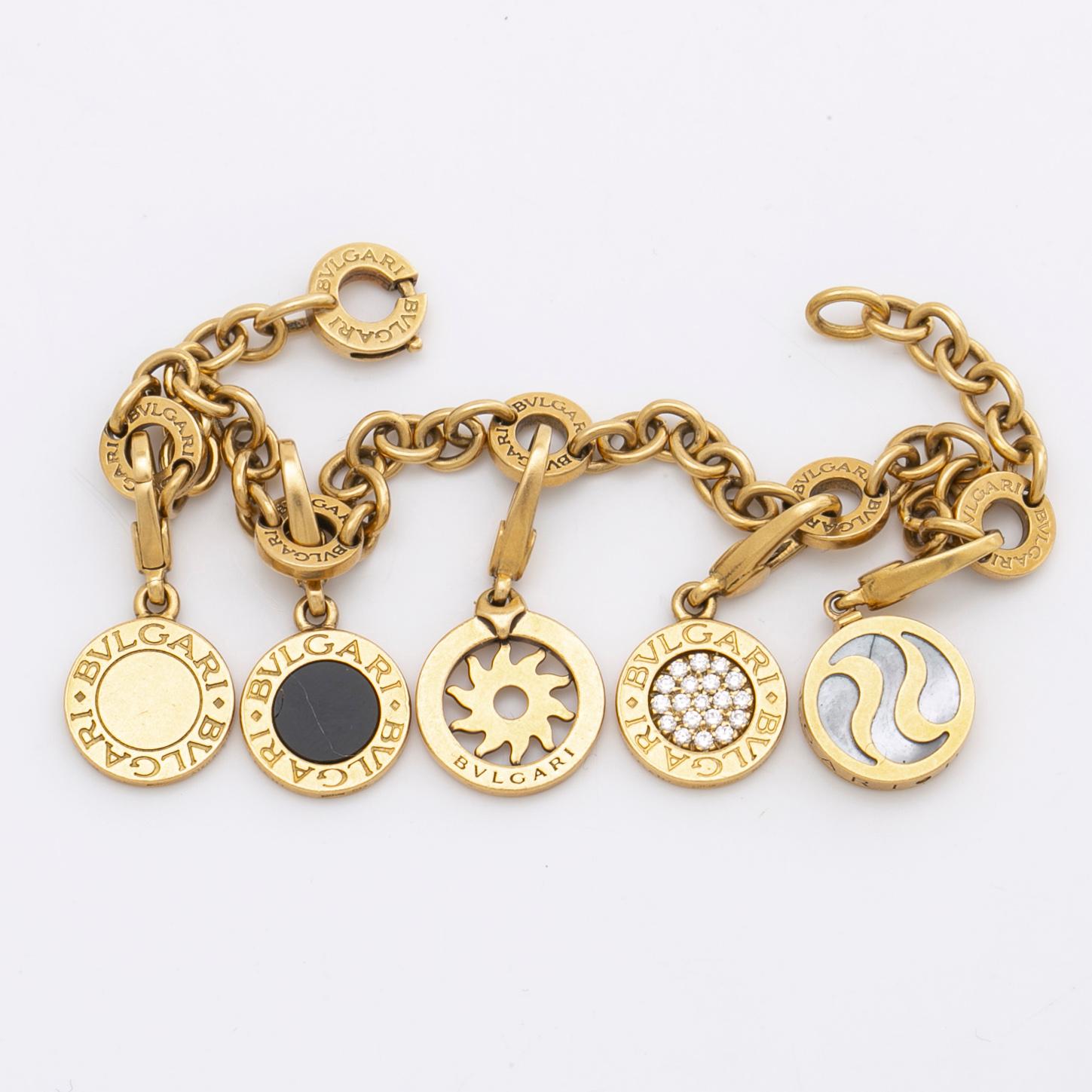 BVLGARI BRACELET w 5 charms detachable 18K gold and whitegold onyx mother of pearl brilliant cut diamonds 0 20 ct. Bukowskis