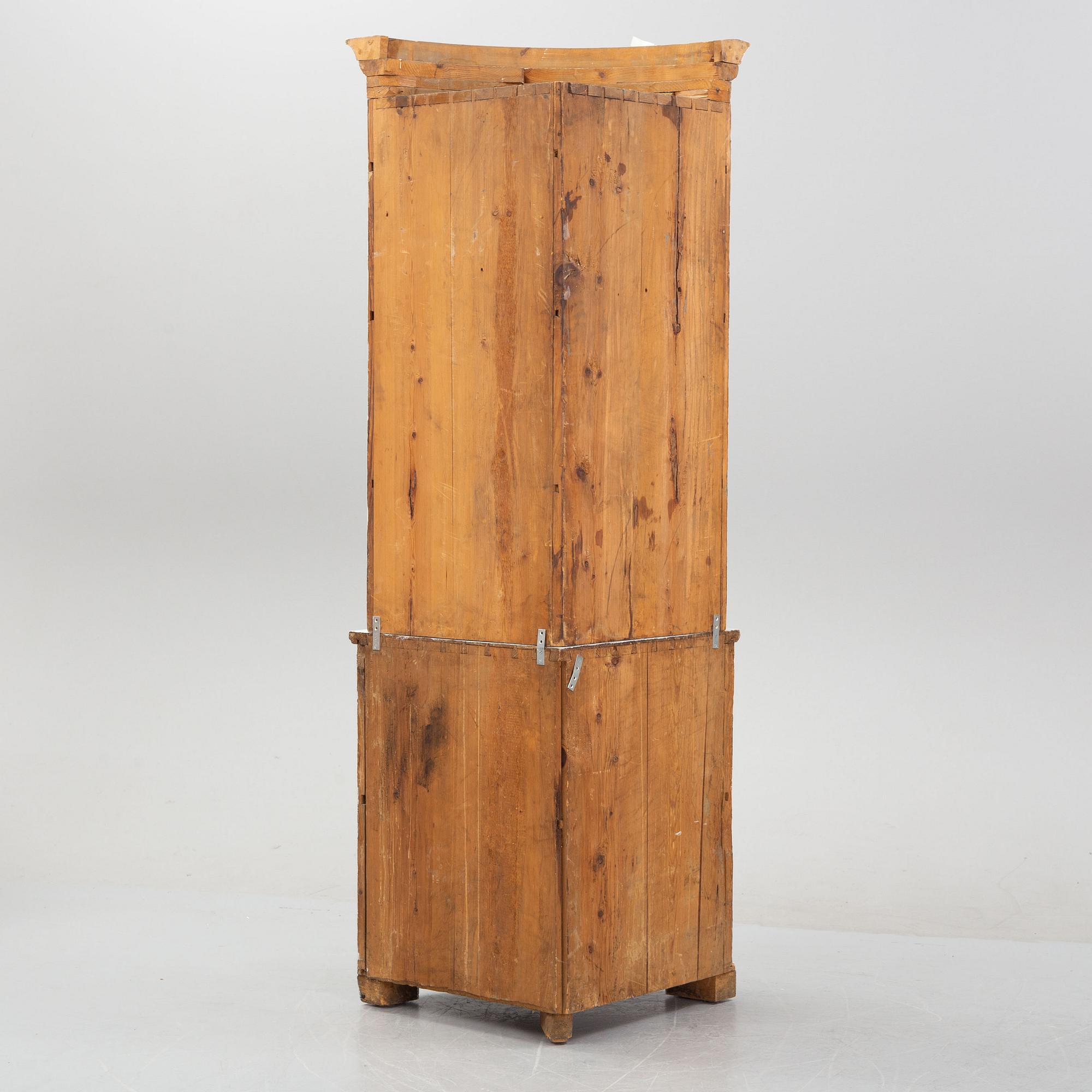 An 19th Century corner cabinet.