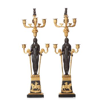 81. A pair of Russian Retour d'Egypte Empire Alexander I five-light candelabra, St. Petersburg.