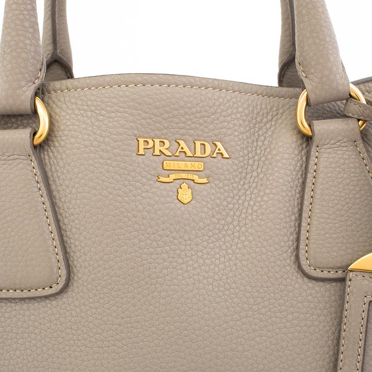 A tote/crossbody handbag by Prada.