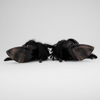 BALENCIAGA, a pair of brown and black leather sandalettes with pony hair.