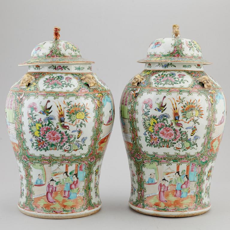 A pair of large canton famille rose vases with covers, Qing dynasty, late 19th century.