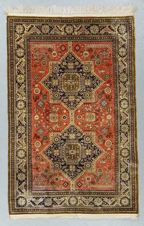 A rug, an old silk Qum, ca 158 x 104,5 cm (as well as ca 2 cm flat weave at the ends).
