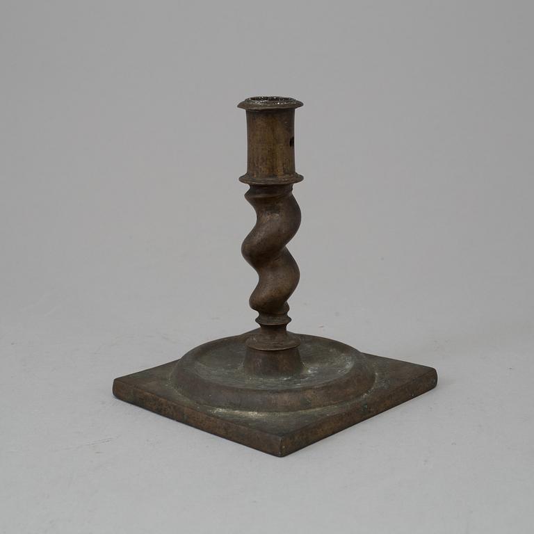 AN 18TH CENTURY BAROQUE CANDLESTICK.