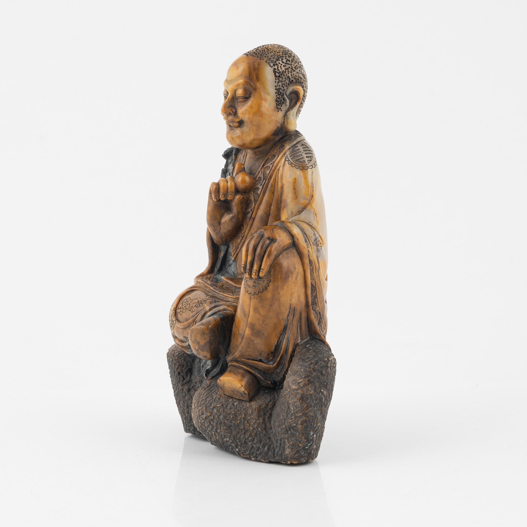 A soapstone sculpture of a lohan, late Qing dynasty.