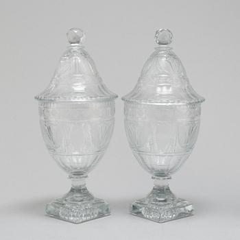 A pair of late 19th century lidded glass cups.