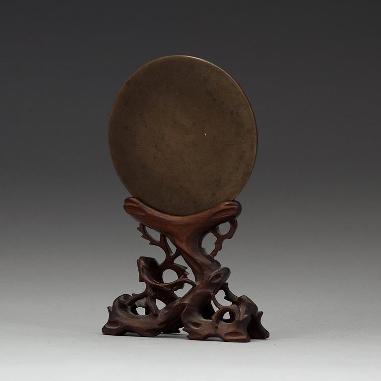 Ana archaistic bronze mirror.