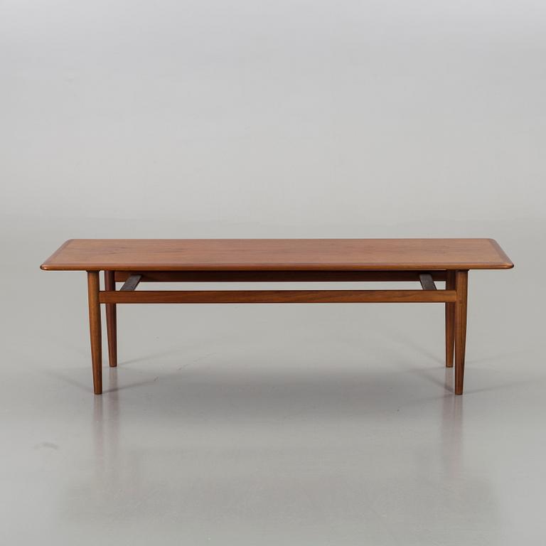 A Danish teak lounghe table.