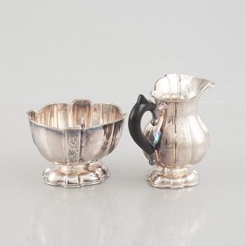 A silver coffee pot, creamer and sugarbowl, Swedish import marks, JL Hultman, circa mid-20th century.