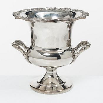 A white metal wine cooler, 20th century.