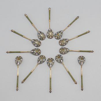 A set of twelve Fabergé silver-gilt and cloisonné enamel tea-spoons small, work master Fedor Rückert, Moscow 1908-1917.