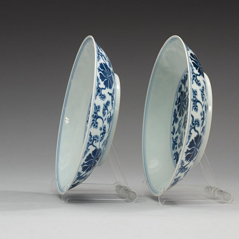 A pair of blue and white lotus dishes, Qing dynasty (1644-1912) with Qianlong seal mark.