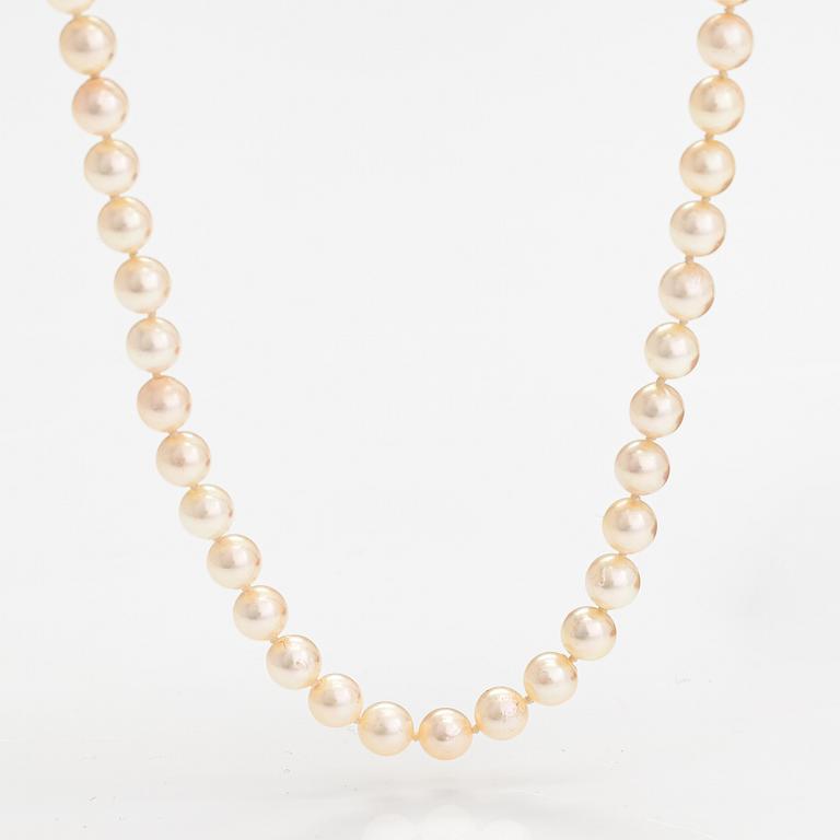 Helminauha, viljellyt helmet, metallilukko.